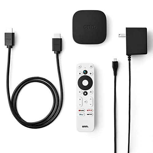 Streaming device with remote, HDMI cables, and power adapter. 